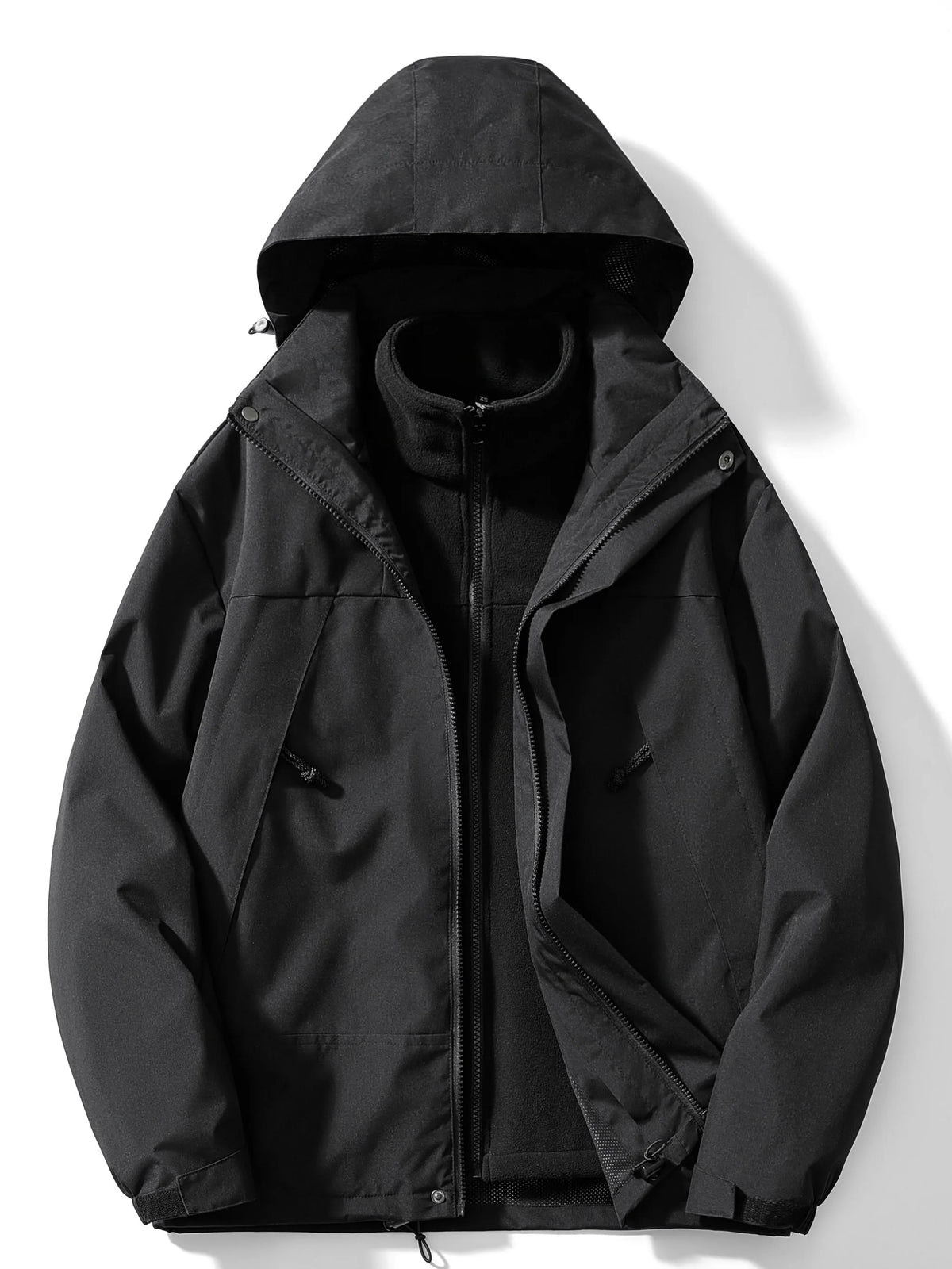 Black hooded 3-in-1 jacket laid flat and unzipped, revealing the zip-in fleece liner with stand collar