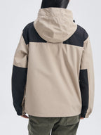 Close-up front view of the jacket's outer shell fabric, zip pockets and toggle drawstring at the hem