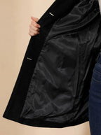 Close-up of black coat interior showing smooth satin-style lining and inside pocket detail