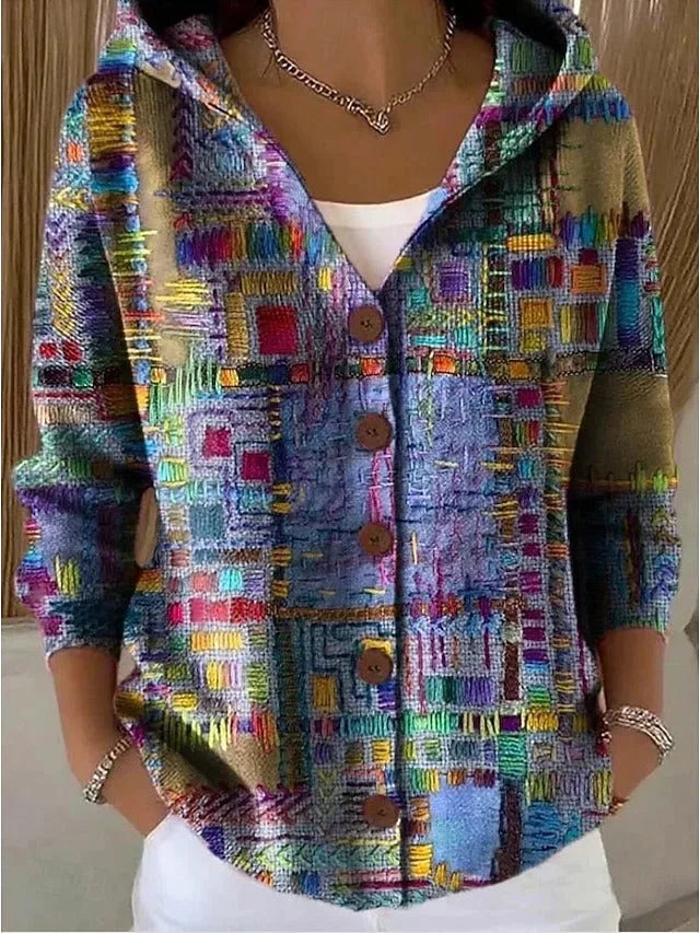 Multicolour patchwork-print hooded cardigan with brown buttons, worn open over a white top