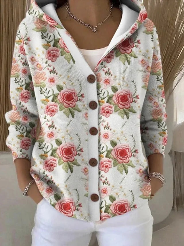 Ivory hooded cardigan covered in a soft pink rose and green leaf pattern