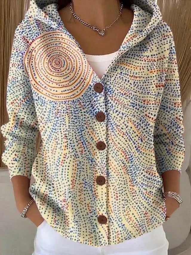 Cream hooded cardigan with a speckled dot texture and a circular sun-ray motif