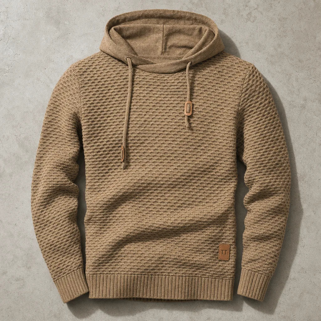 Tan knitted pullover hoodie laid flat, highlighting the honeycomb-style weave and ribbed hood lining