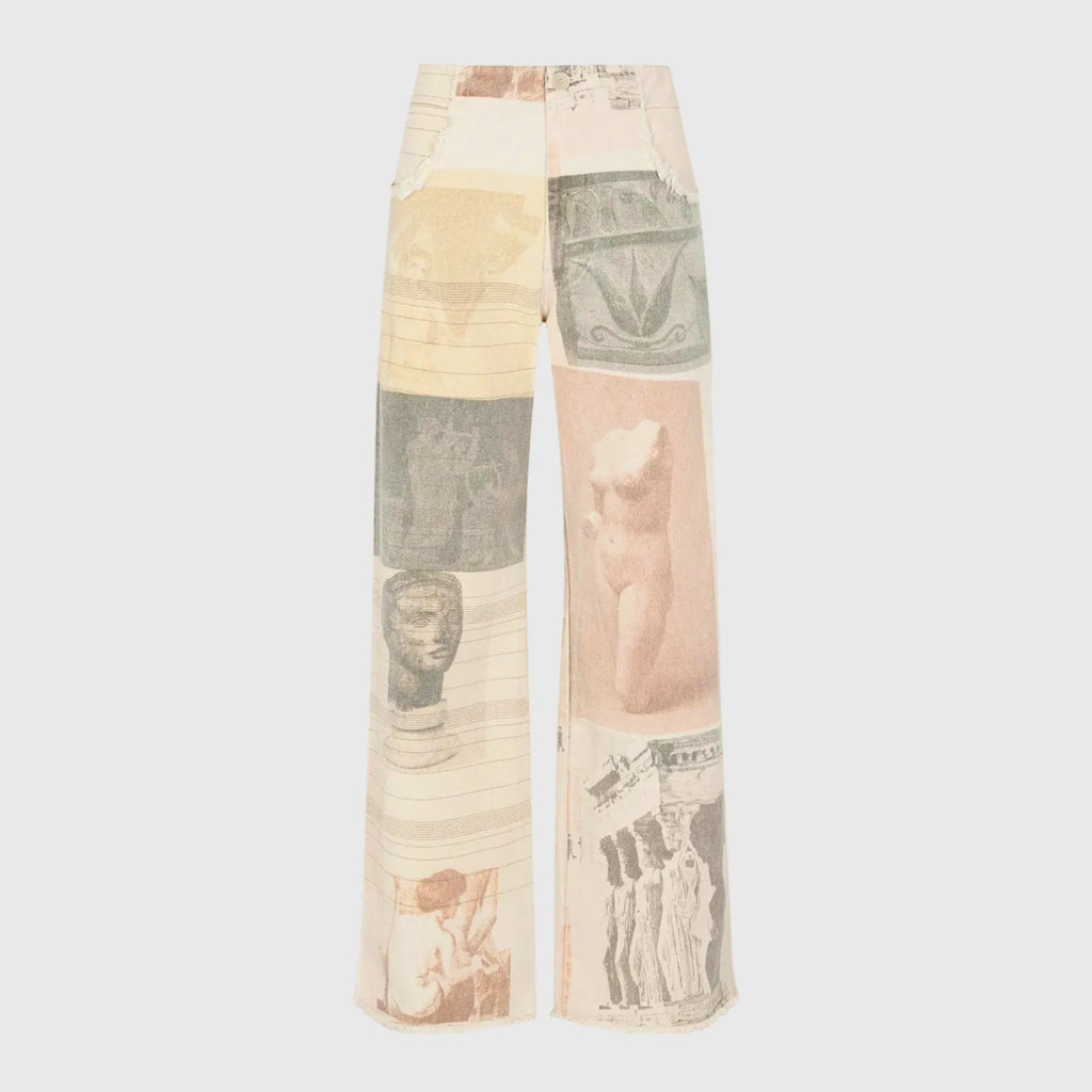 Flat lay front view of the wide-leg jeans showing the full patchwork print from waist to frayed hem