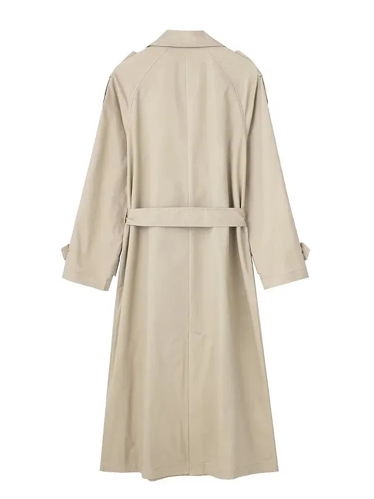 Back view of beige belted trench coat showing raglan sleeves and back waist strap