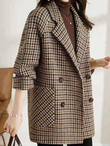 Side profile of the checked blazer highlighting the oversized fit and rolled-up sleeve detail