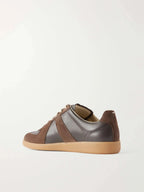 Back heel view showing the suede heel panel and gum outsole