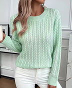 Detail shot of the cable-knit texture pattern running down the sleeve