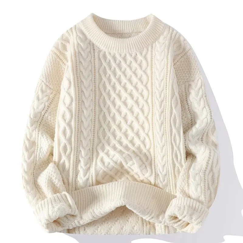Cream cable-knit jumper with ribbed crew neck, laid flat to show the raised diamond and braid stitch pattern