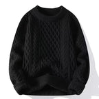 Black cable-knit jumper with ribbed cuffs and hem, front view showing the textured knit panels