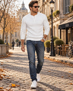 Off-white cable-knit Henley jumper with sunglasses, layered over a white tee with jeans and trainers for a smart-casual look.