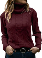 Apricot cable-knit polo neck jumper worn with denim, full torso view