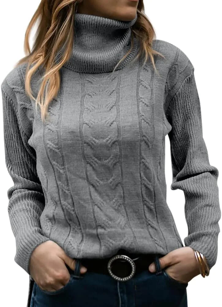 Grey cable-knit polo neck jumper worn with jeans, front detail of the cable knit