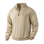 Front view of beige cable-knit quarter-zip jumper with textured yoke and stand collar, angled on mannequin