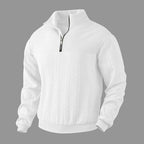 Beige cable-knit quarter-zip jumper displayed against white backdrop showing overall relaxed silhouette