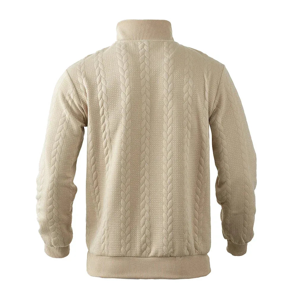 Back view of beige quarter-zip jumper showing full cable-knit pattern across the shoulders and body