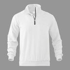 White quarter-zip jumper on grey background, front view showing ribbed stand collar and cable knit