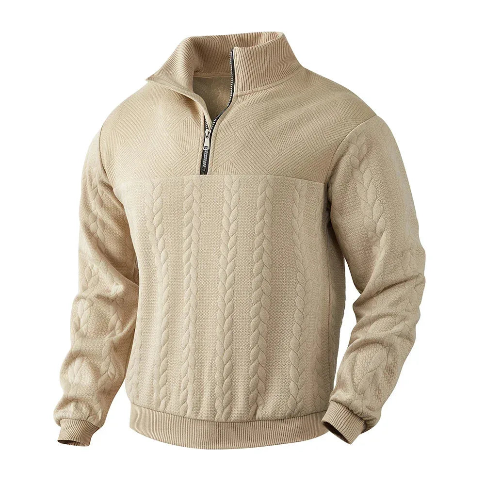Angled front view of beige quarter-zip jumper showing raised collar and diamond-textured shoulder panel