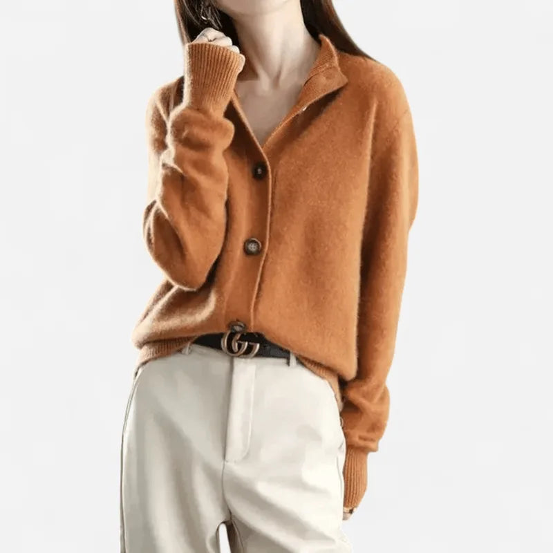 Rust orange cashmere cardigan with notched collar, wooden buttons and a gold buckle belt