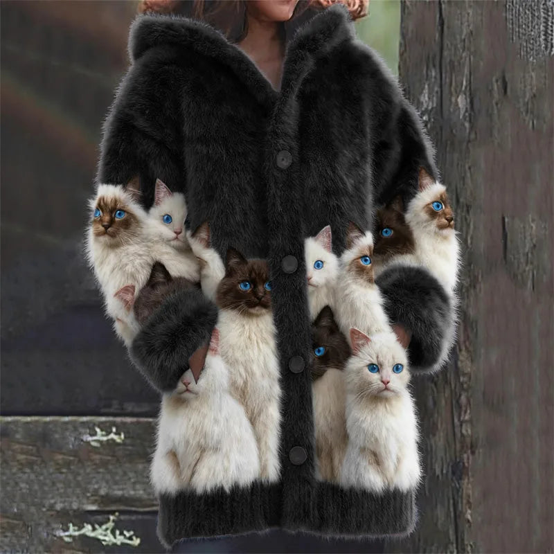 Black faux fur hooded cardigan with cat print on sleeves and front panels, worn over dark trousers