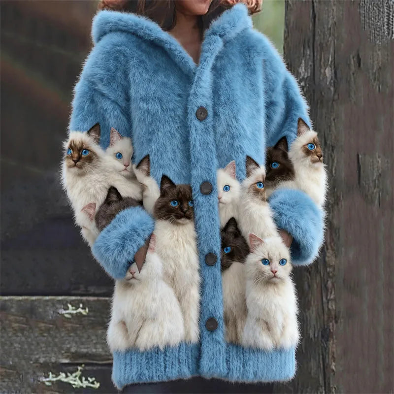 Light blue faux fur hooded cardigan with cat print sleeves and ribbed hem, buttoned up front