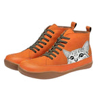 Orange high-top leather boots with a hand-painted grey tabby cat peeking design and olive laces, angled front view