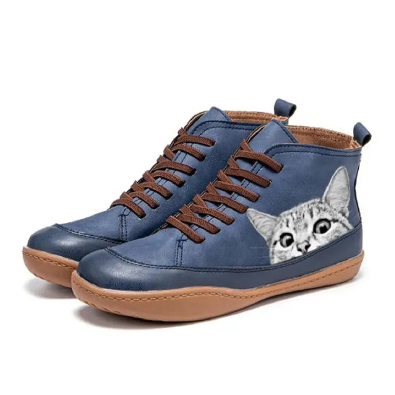 Navy blue high-top boots with a peeking cat print and contrasting brown laces, shown as a pair