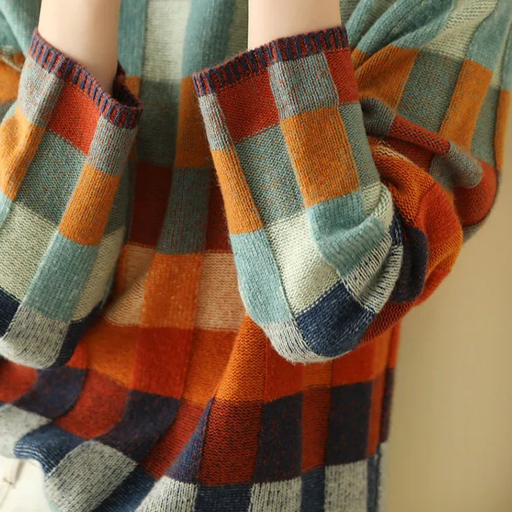 Folded view of the sleeve cuffs showing the ribbed edging and patchwork check colourway
