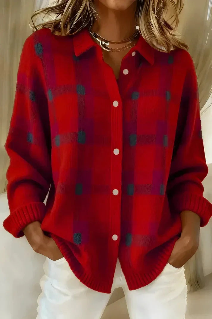 Red and grey checked knit shacket with pearl-style buttons and pointed collar, paired with white jeans