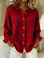 Red and burgundy checked knit shirt jacket with white buttons and ribbed cuffs, front view close-up
