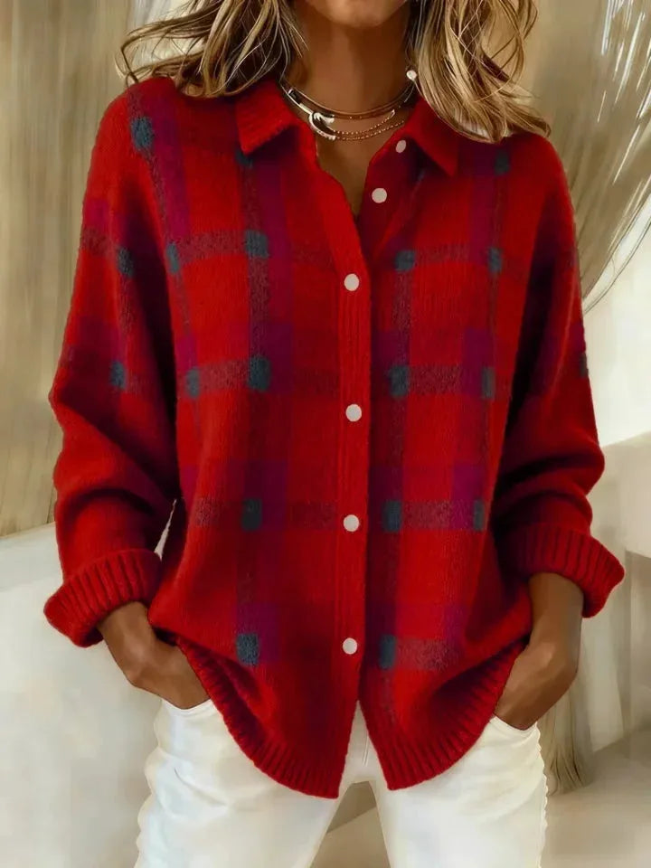 Red and burgundy checked knit shirt jacket with white buttons and ribbed cuffs, front view close-up