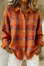 Orange and red checked knit shacket with contrast blue accents and folded ribbed sleeve cuffs