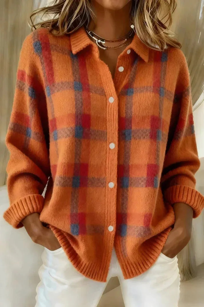 Orange and red checked knit shacket with contrast blue accents and folded ribbed sleeve cuffs