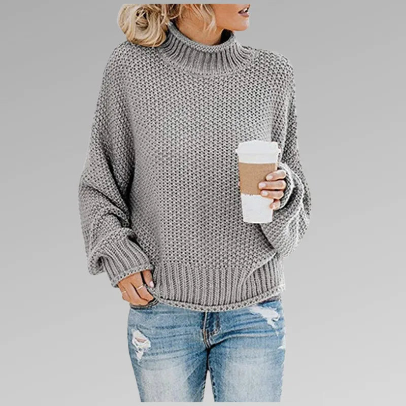 Grey chunky knit oversized jumper with high neck and dropped shoulder seams