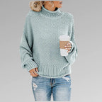 Sage green knit polo neck jumper with textured stitch pattern and loose fit
