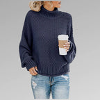 Navy blue chunky knit jumper with ribbed polo neck and oversized batwing sleeves