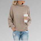 Beige textured knit jumper with polo neck and voluminous long sleeves, front detail view