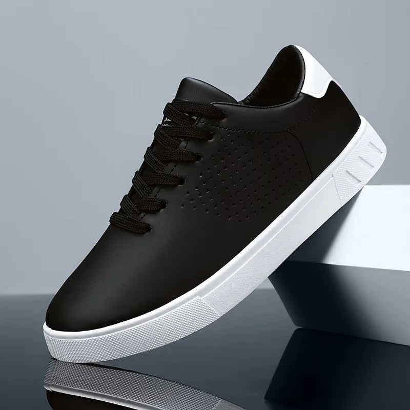 Single black trainer with white heel patch and perforated toe balanced on a glossy block