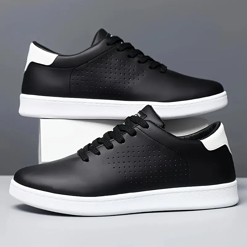 Side view of black low-top trainers with white sole and heel accent, one resting against the other