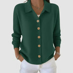 Army green ribbed cardigan with tan wooden buttons and long sleeves, relaxed collared fit