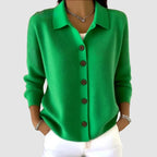 Vivid green knit cardigan with collared neckline and button-front closure, close-up front detail