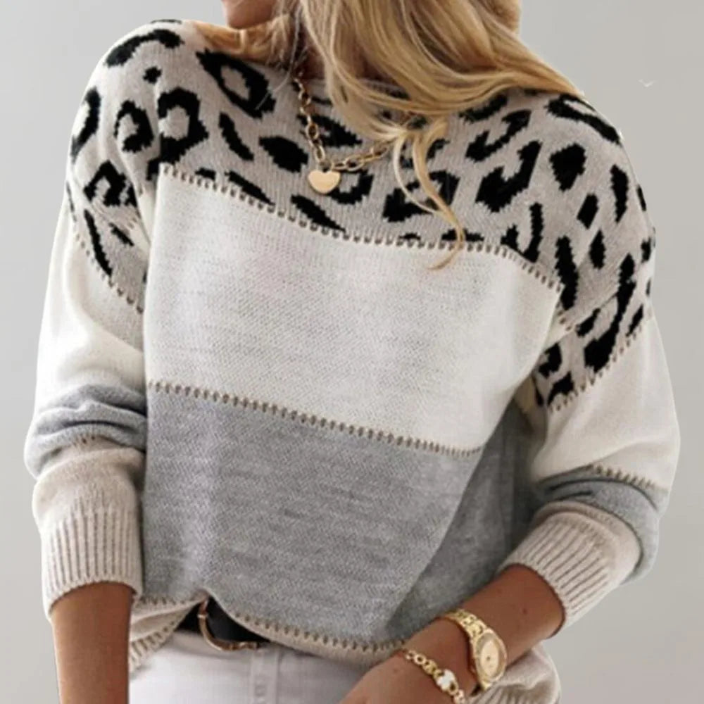 Back view of the white and grey colour-block jumper showing the leopard print across the shoulders