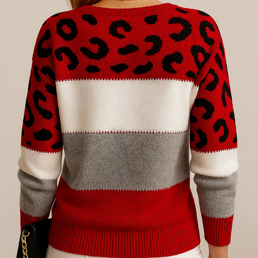 Back view of a red, white and grey striped jumper with black leopard print panels on the shoulders and sleeves