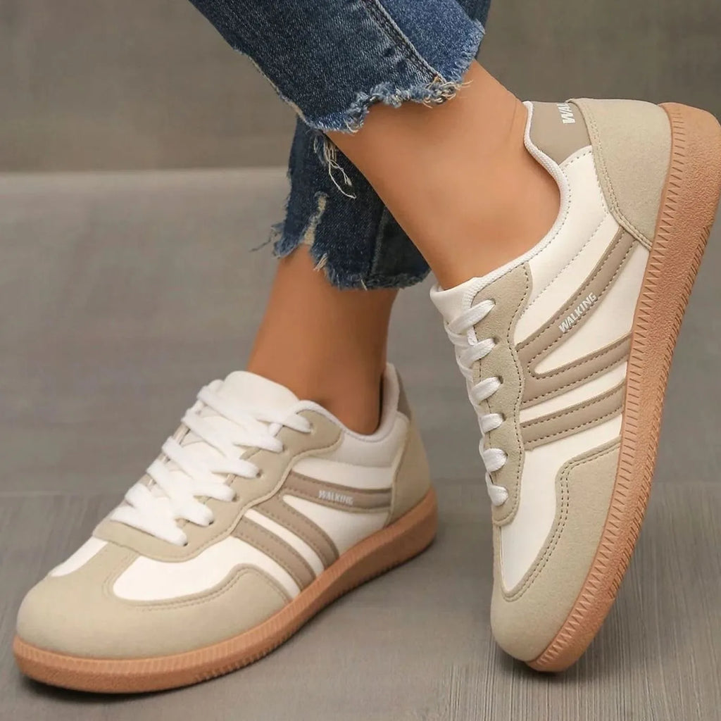 Side view of black and white trainers with visible WALKING branding