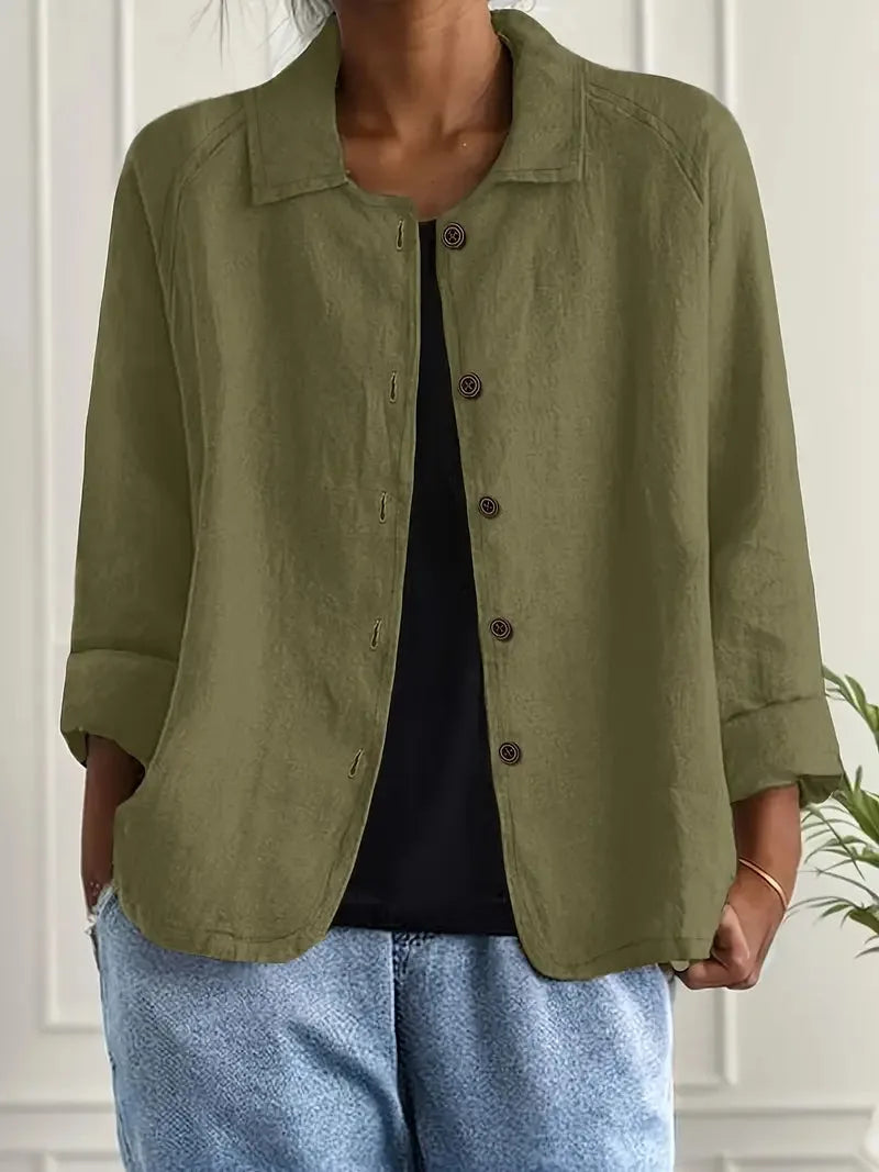 Front view of light blue textured shirt jacket highlighting the point collar and button-through front