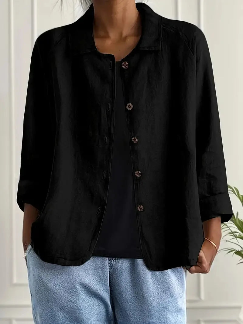 Black textured cotton-linen shirt jacket worn open, showing button placket and relaxed shoulder fit