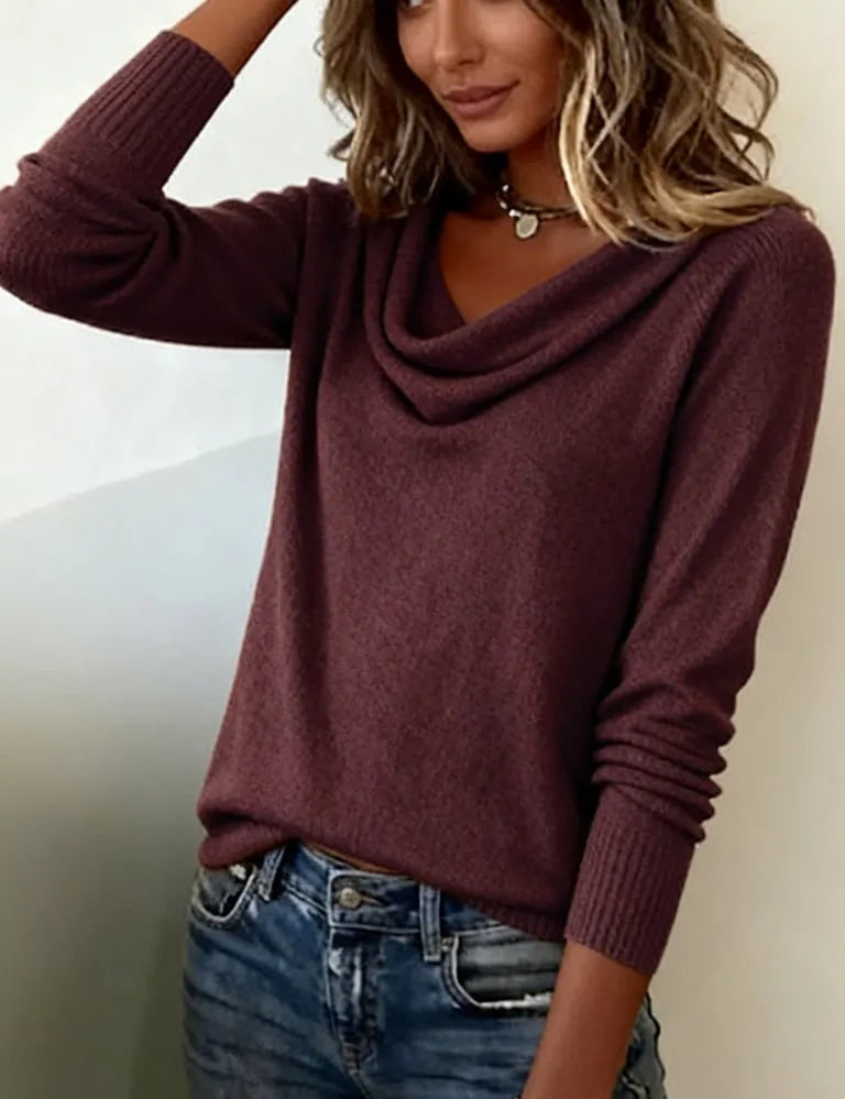 Dark purple cowl neck jumper with ribbed cuffs and relaxed sleeves against a neutral background