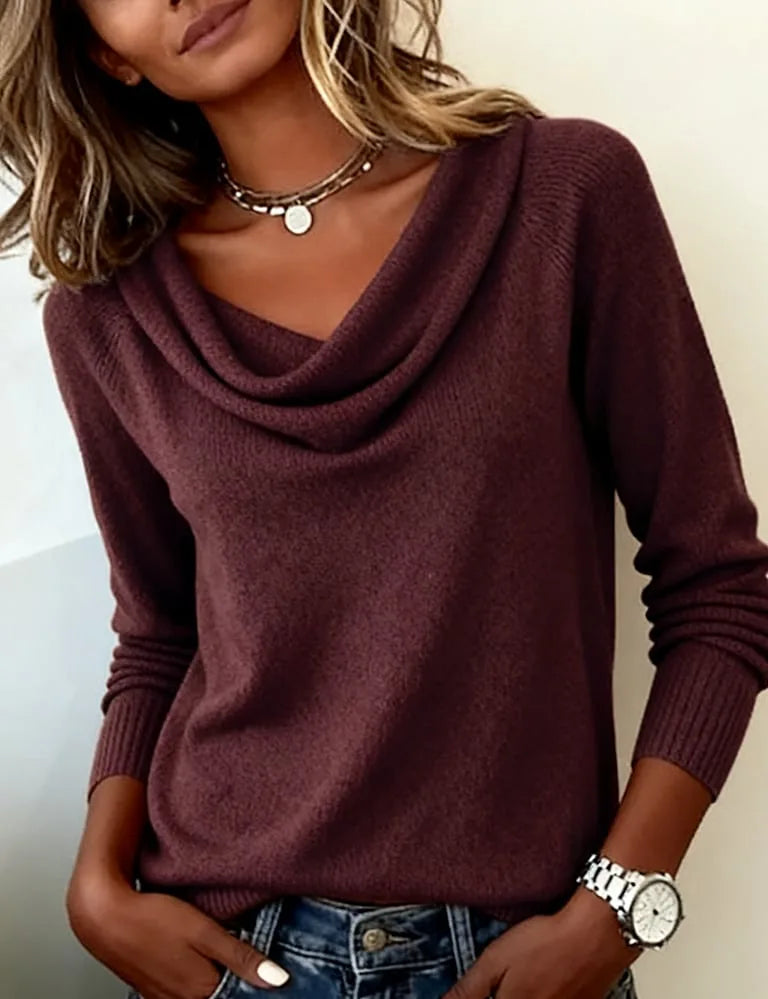 Dark purple cowl neck jumper paired with layered gold necklaces, showing the draped folded collar detail