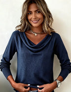 Front view of a brown cowl neck jumper with draped collar sitting softly around the neckline