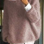 Back view of a dusty rose knitted jumper with a textured fuzzy finish and dropped shoulders on a model